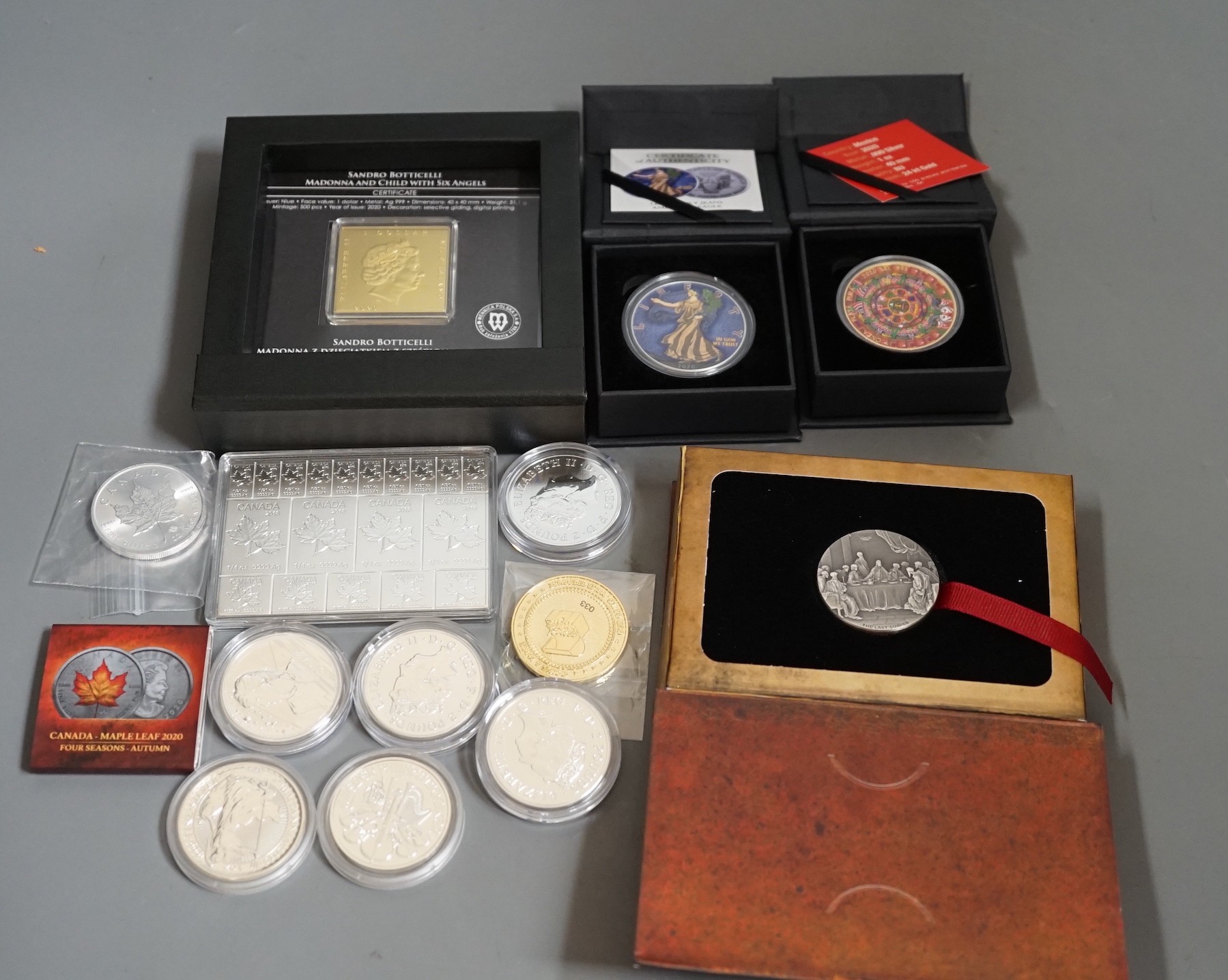 Ten bullion silver 1oz. commemorative coins, a bullion silver 2oz. coin and a Canada 2oz. silver ingot, BU